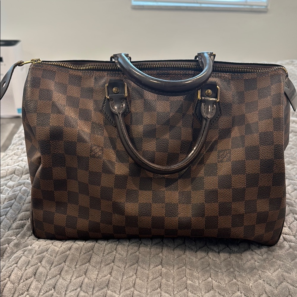 Louis Vuitton Brown Travel Bag with Iconic Design